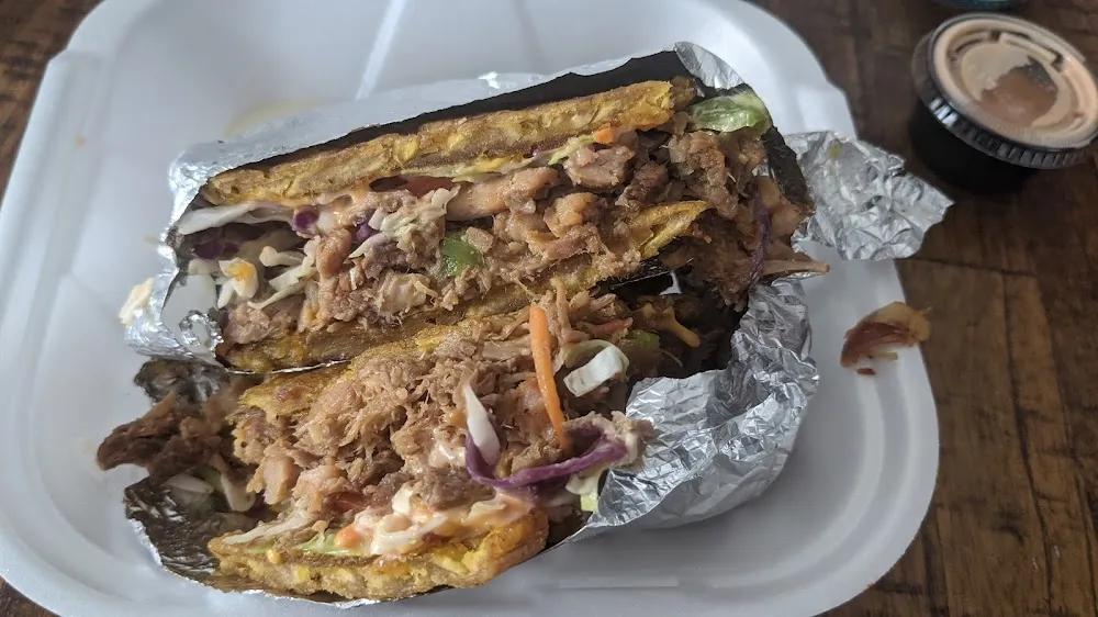 Jibaritos De Tripleta Chicken Pulled Pork and Ham Fried Plantain Sandwich